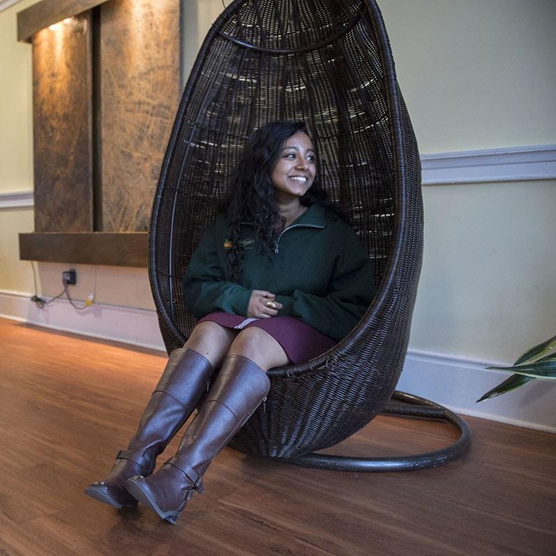 Photo of female student sitting in the Mindfulness Room